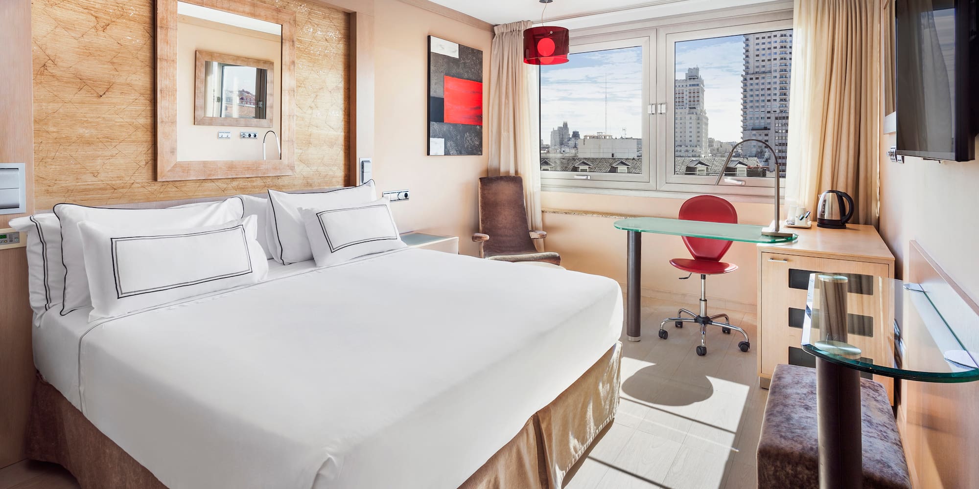 a room with a bed and a desk