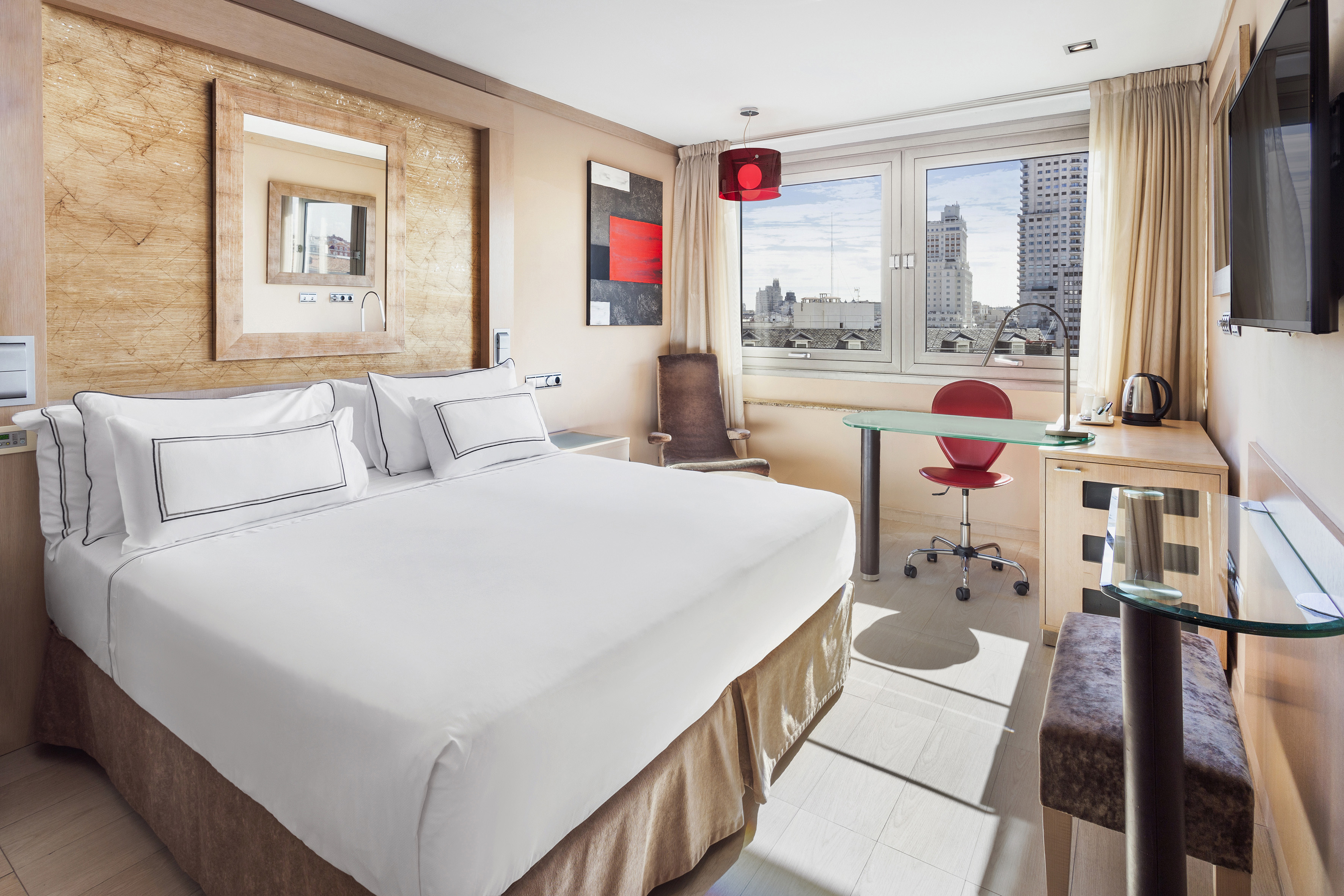 a room with a bed and a desk