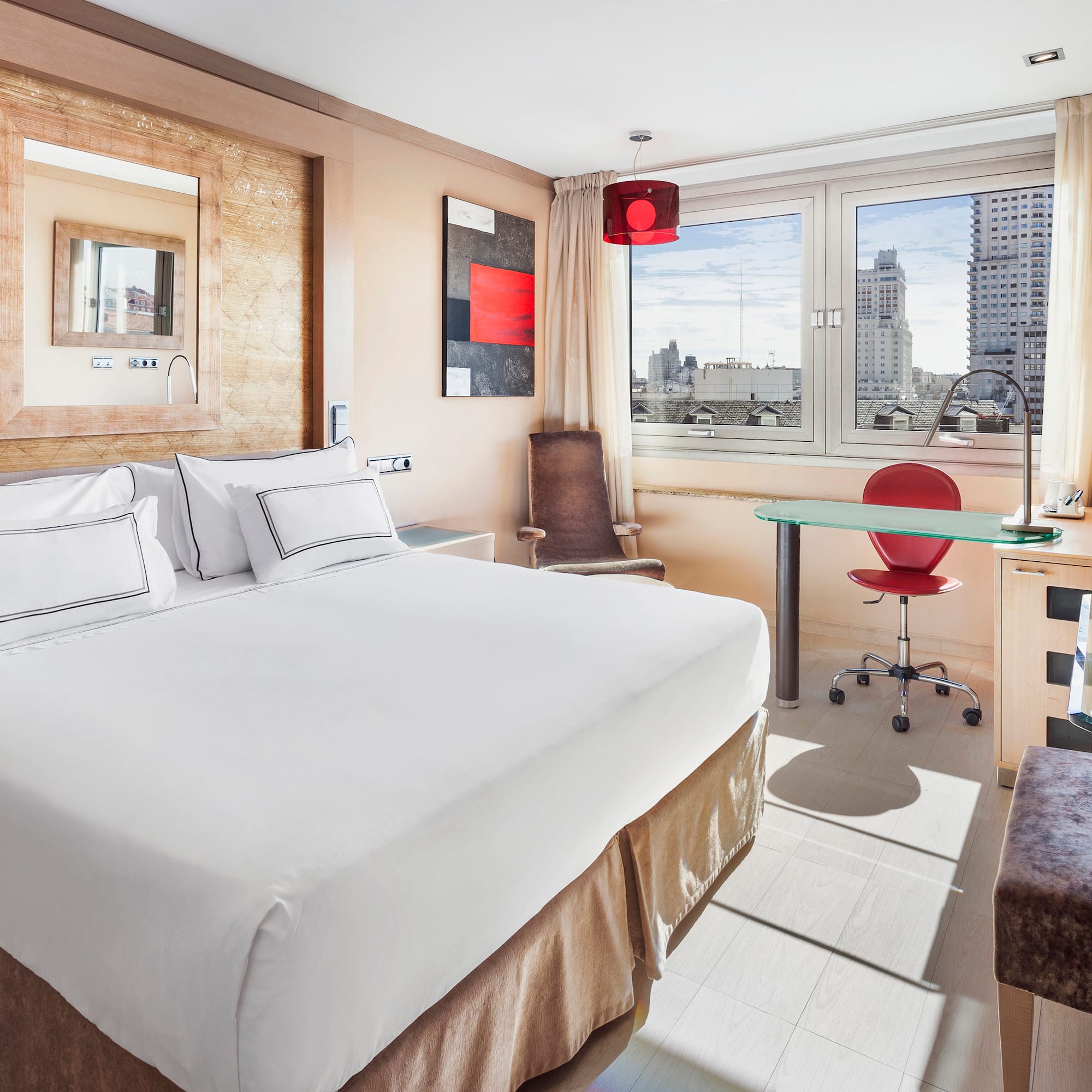 a room with a bed and a desk