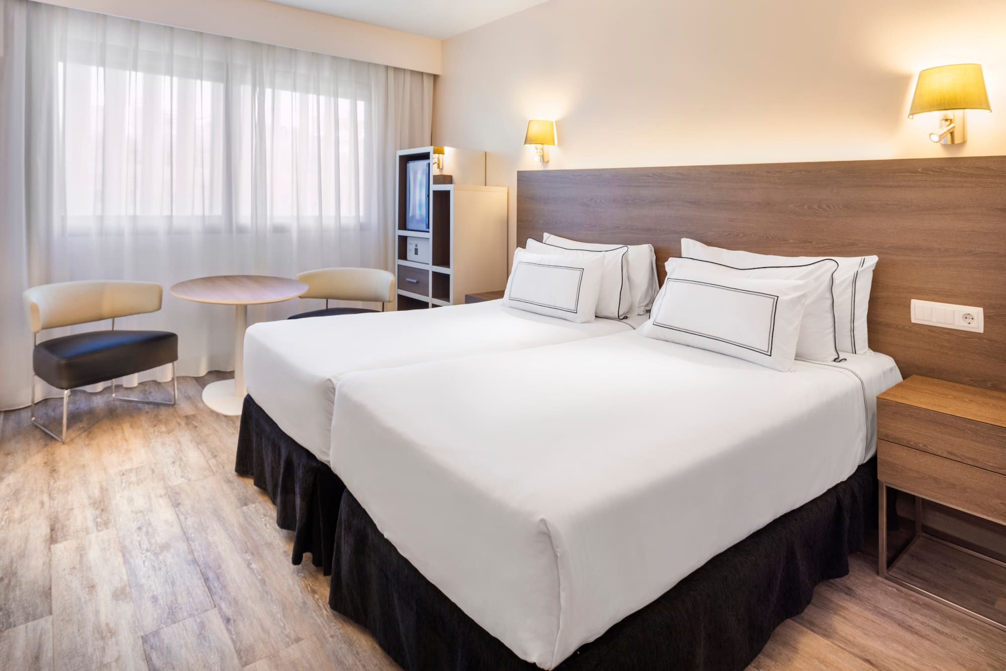 a hotel room with two beds