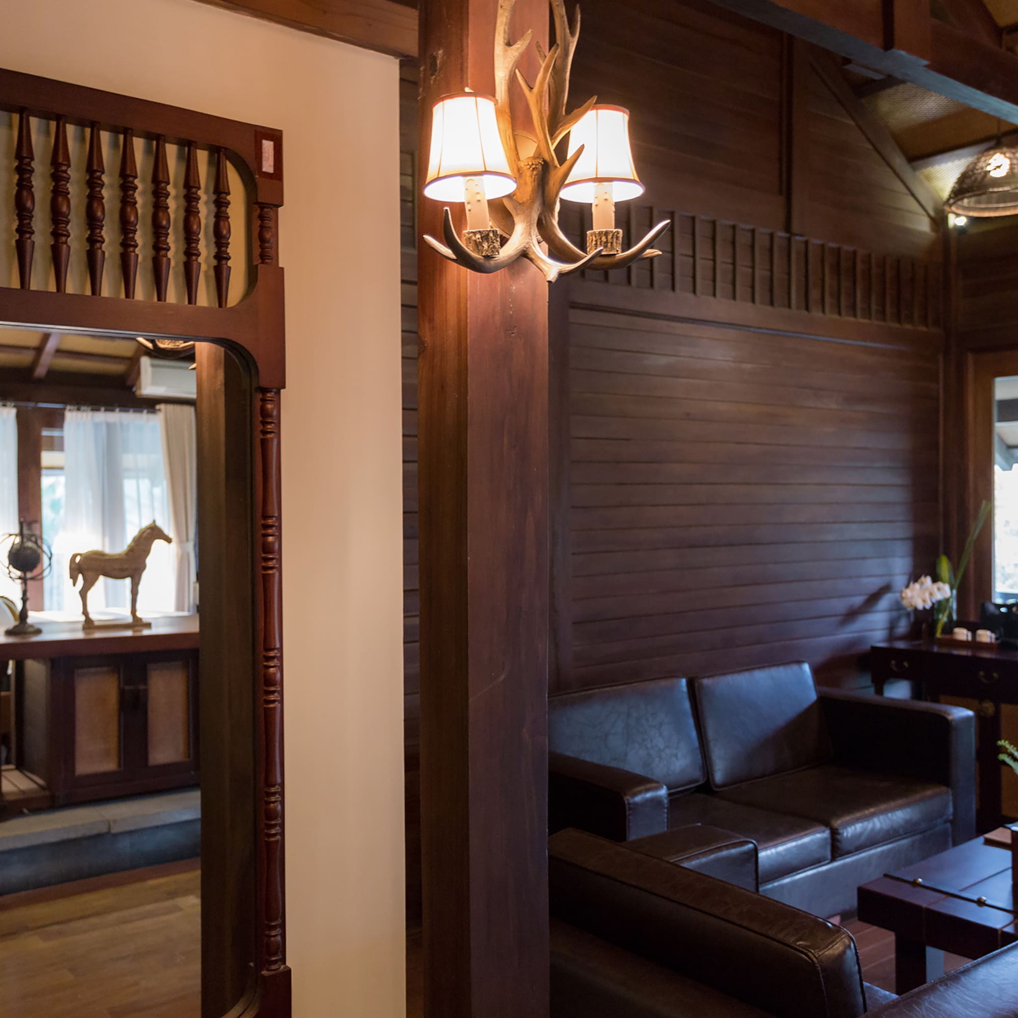 a room with a couch and a mirror