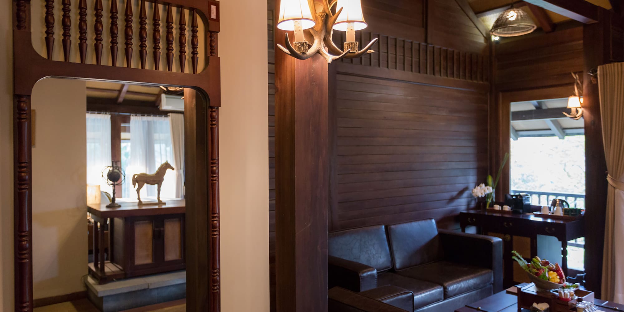 a room with a couch and a mirror