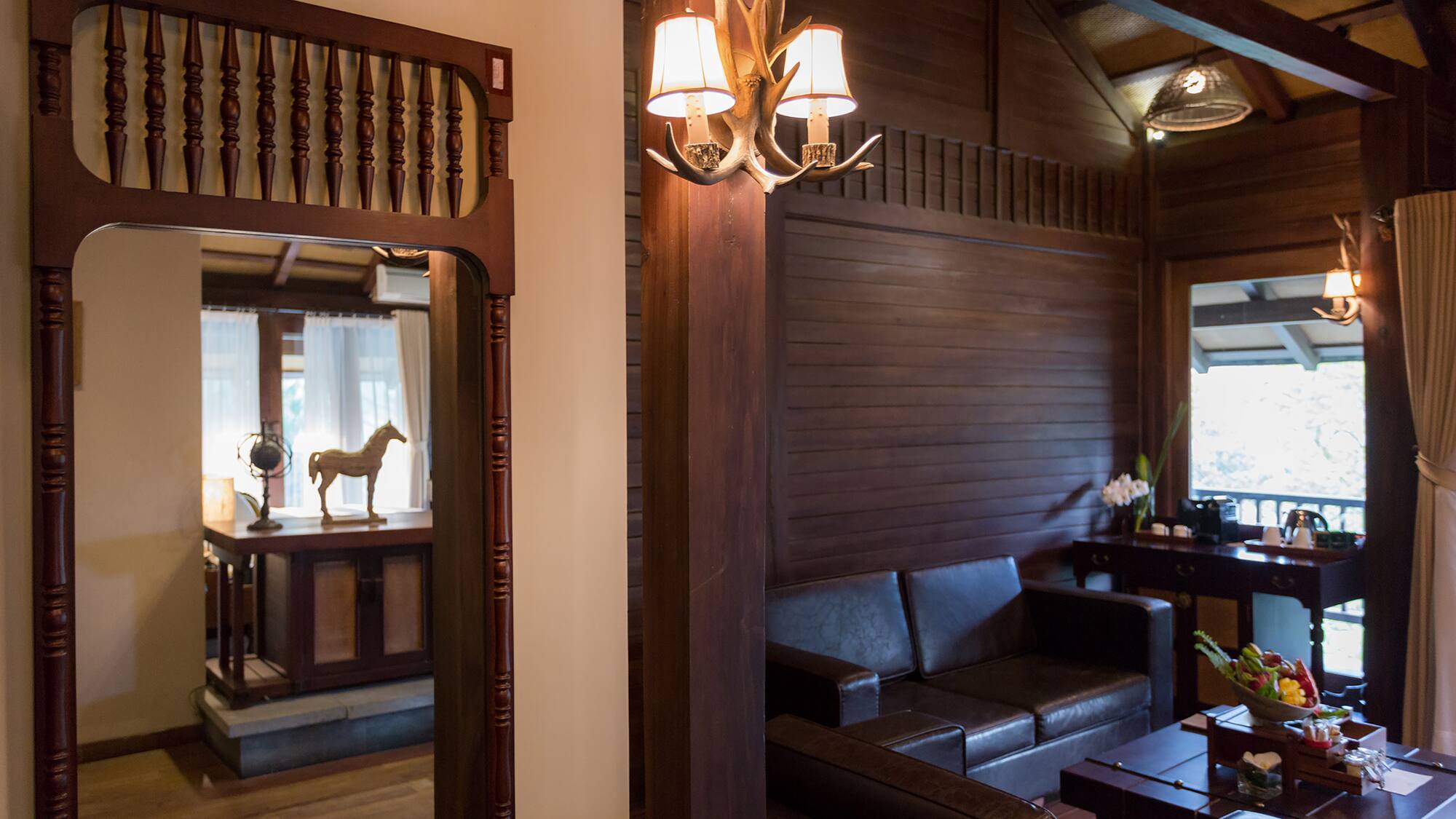 a room with a couch and a mirror