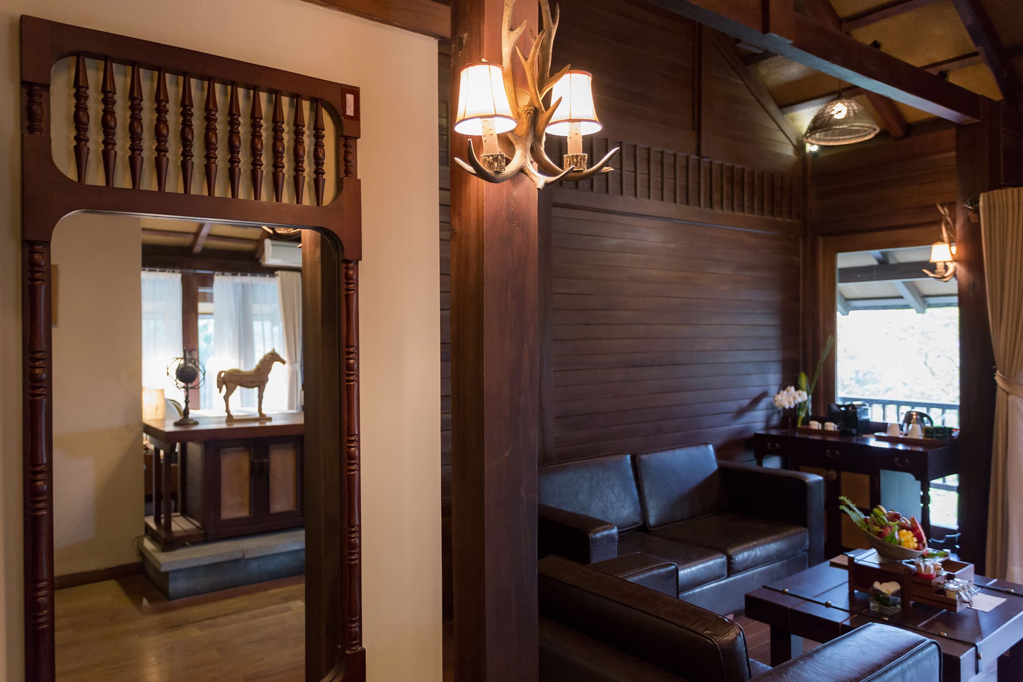 a room with a couch and a mirror