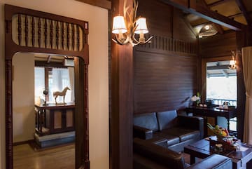 a room with a couch and a mirror