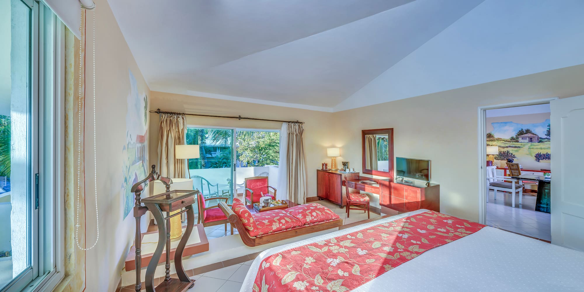 a bedroom with a bed and a television