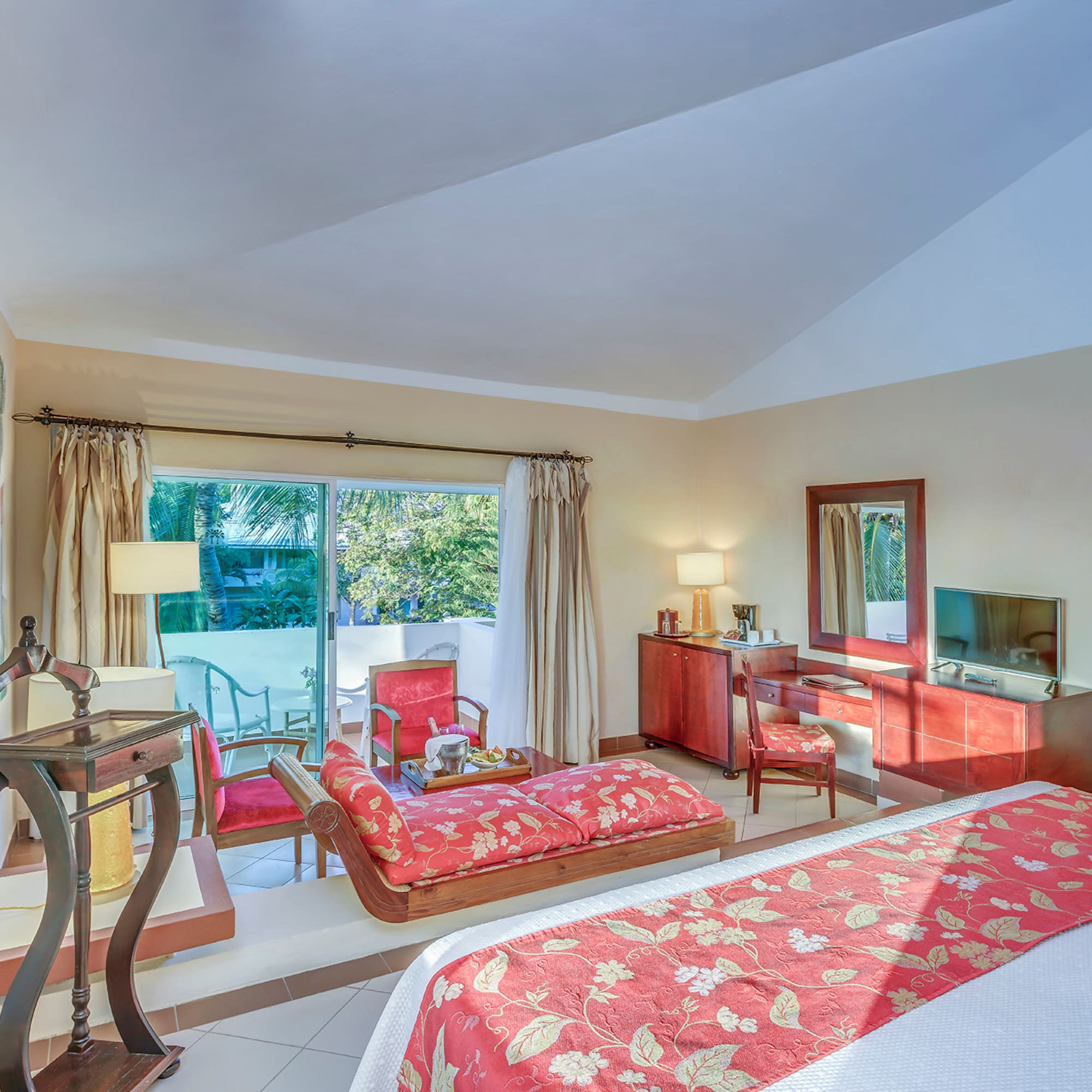 a bedroom with a bed and a television