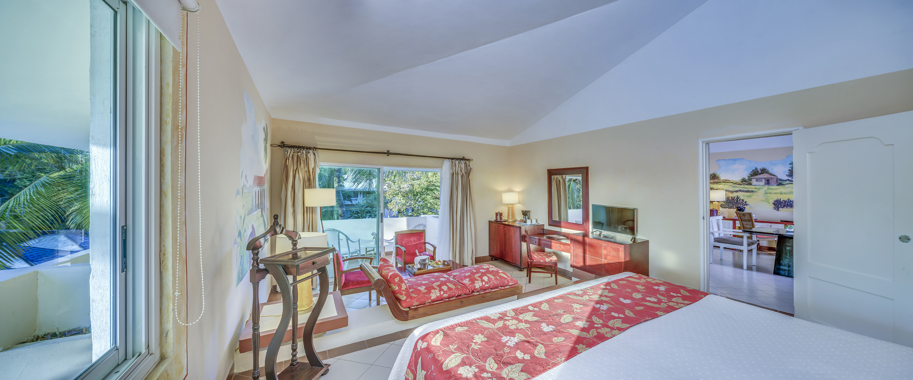 a bedroom with a bed and a television