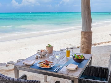 a table with food on it on a beach