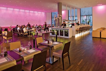 a large room with tables and chairs