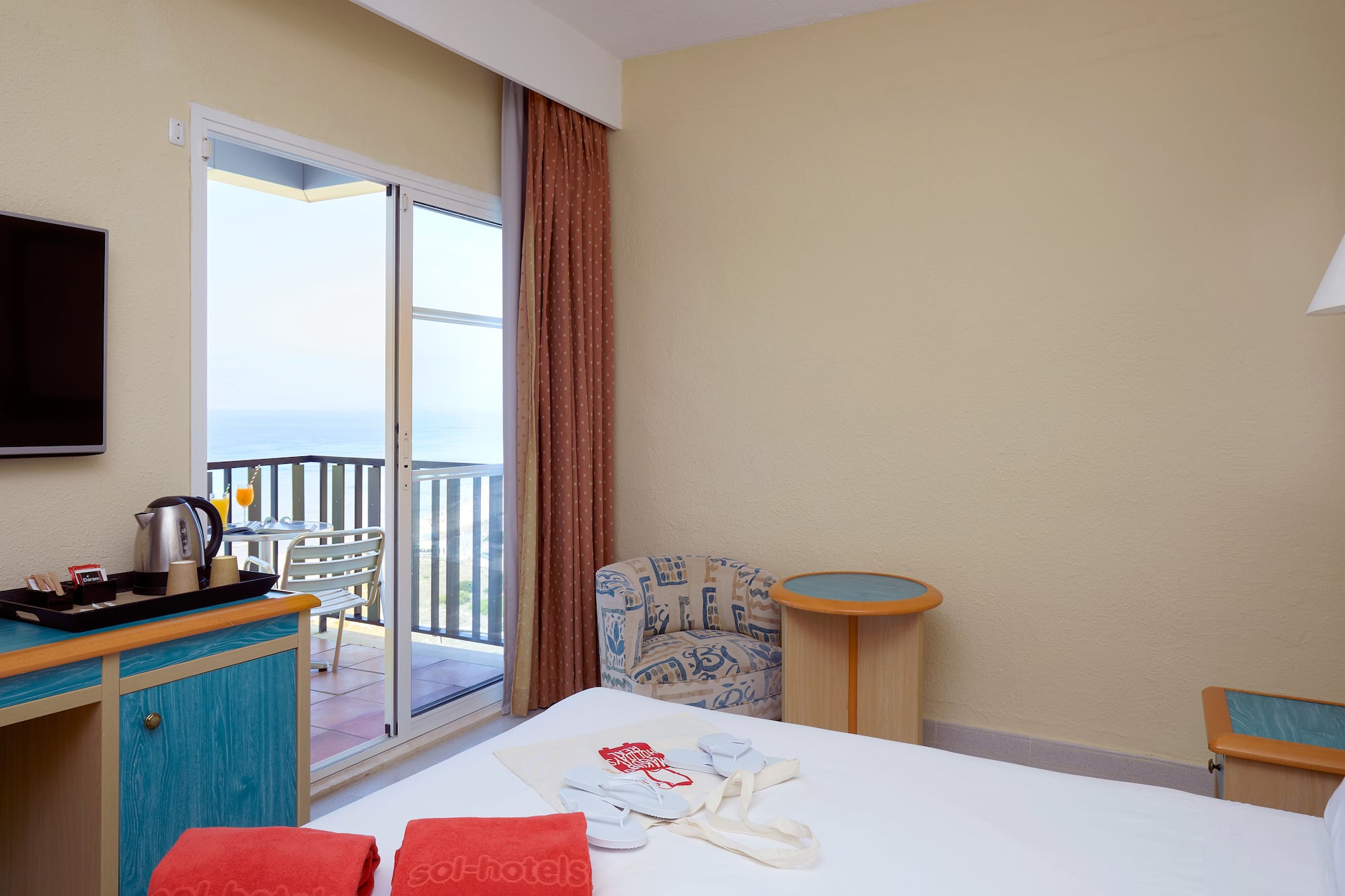 a room with a bed and a glass door