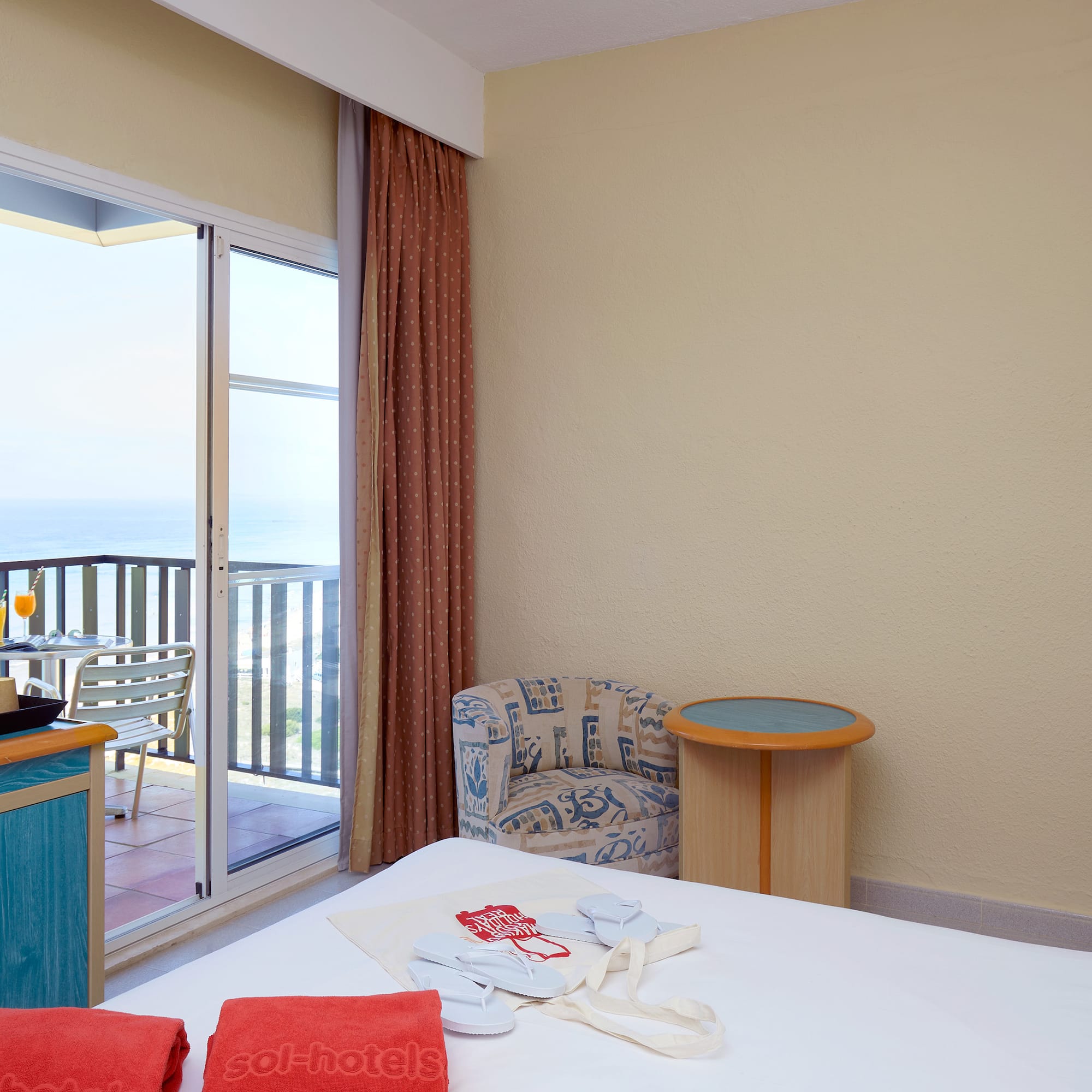 a room with a bed and a glass door