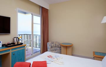 a room with a bed and a glass door