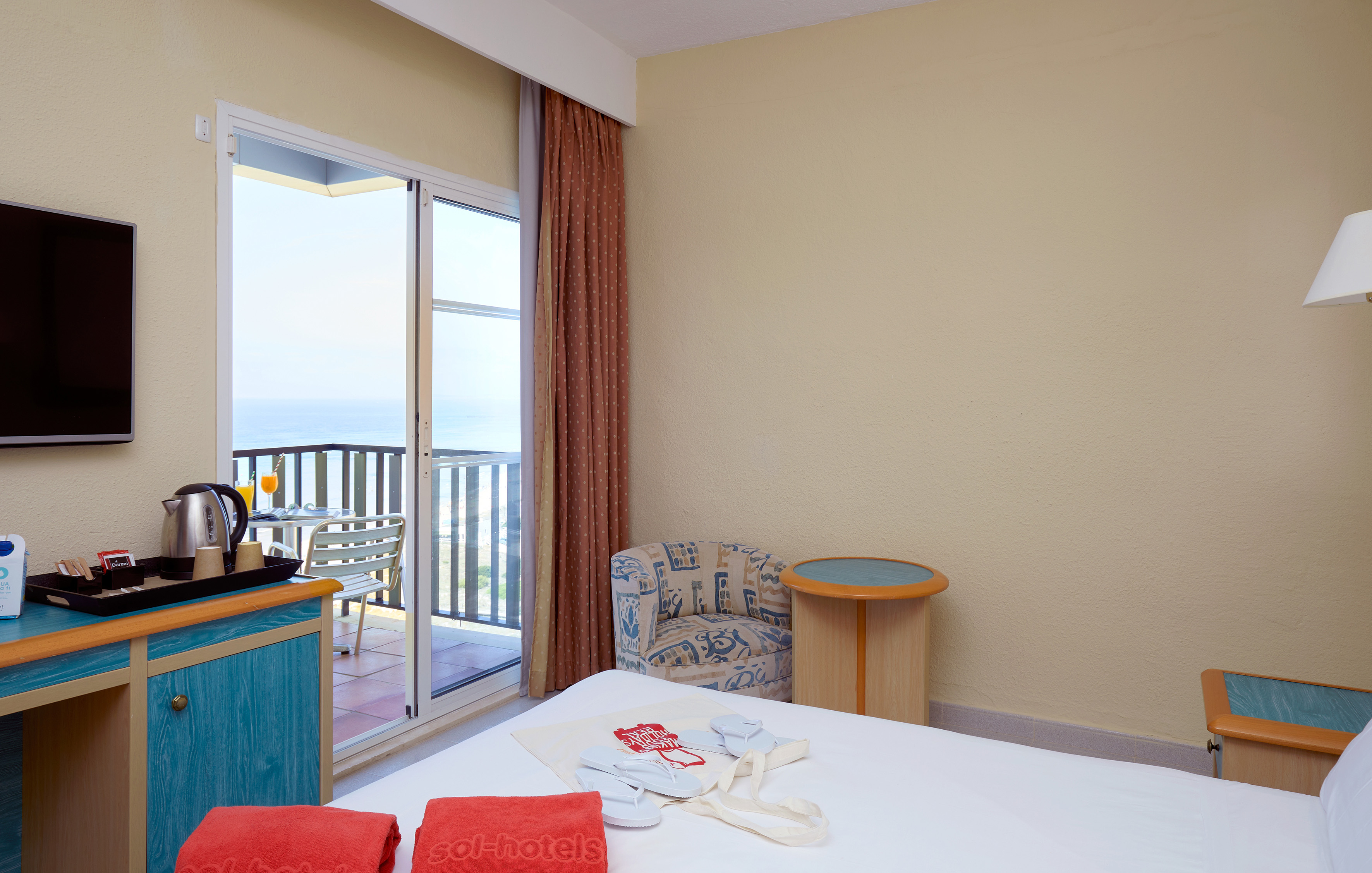 a room with a bed and a glass door