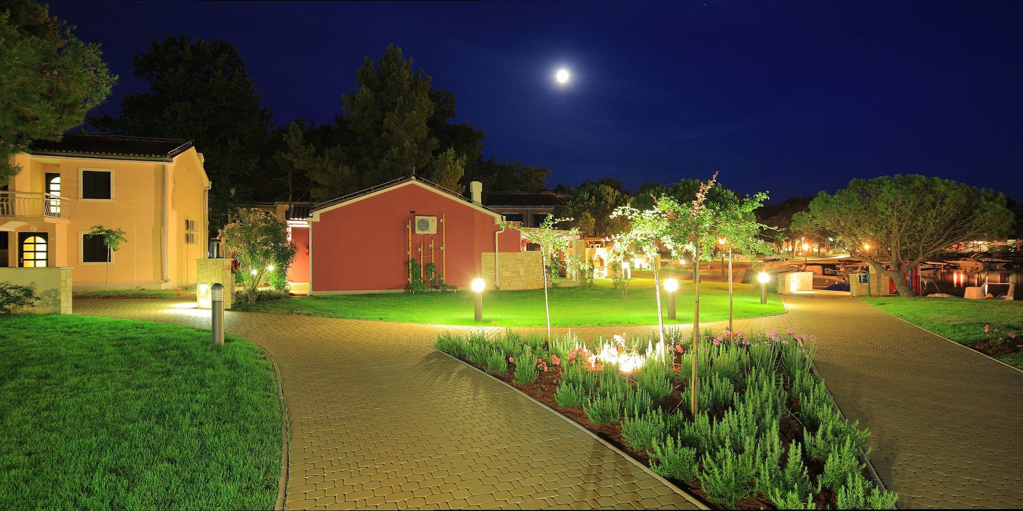 a brick path leading to a house