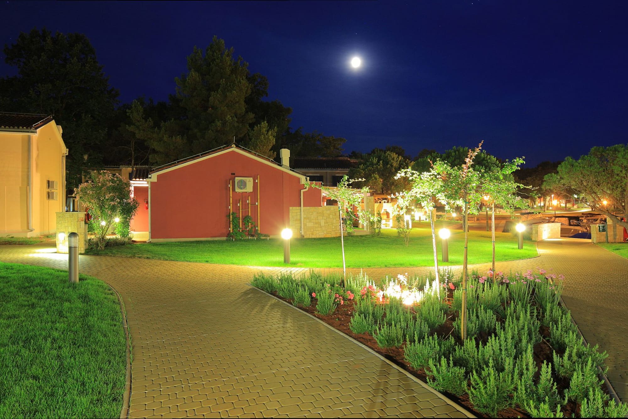 a brick path leading to a house