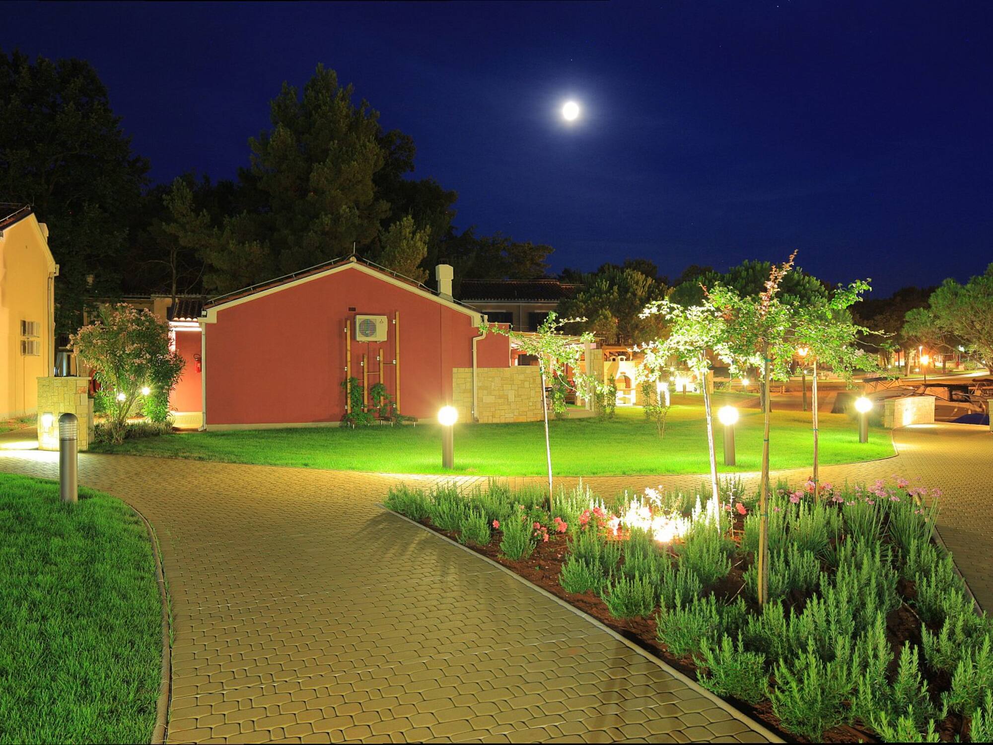 a brick path leading to a house