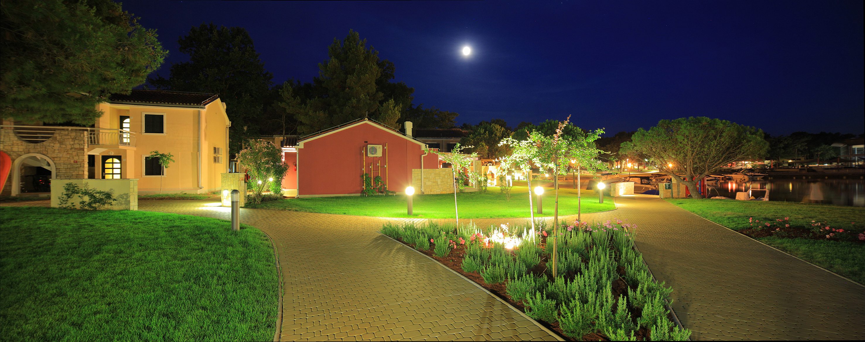 a brick path leading to a house