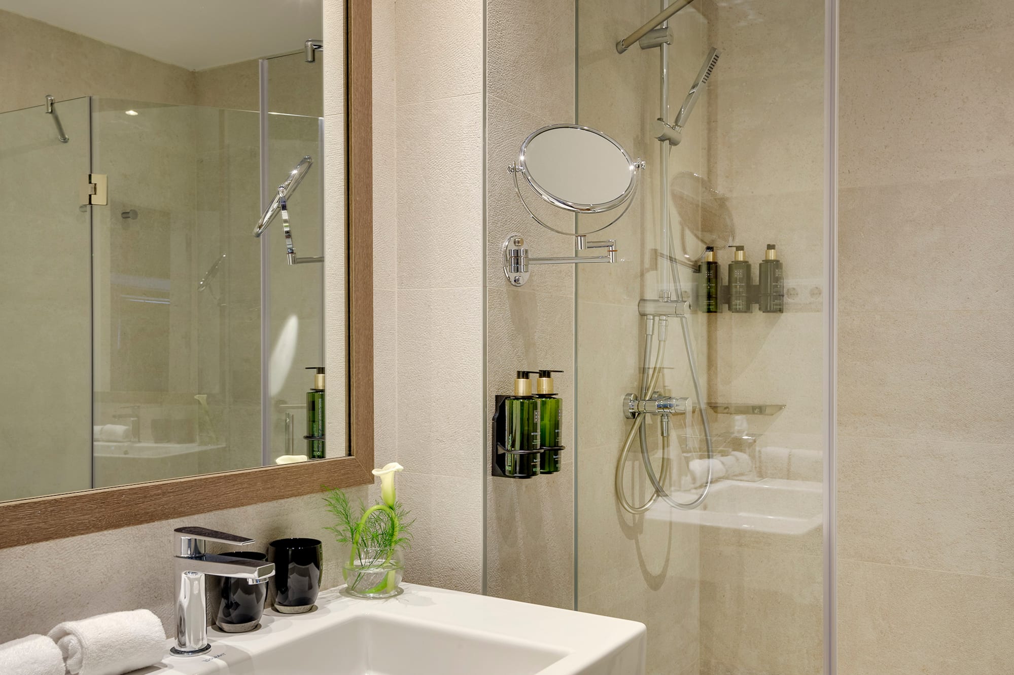 a bathroom with a shower and sink