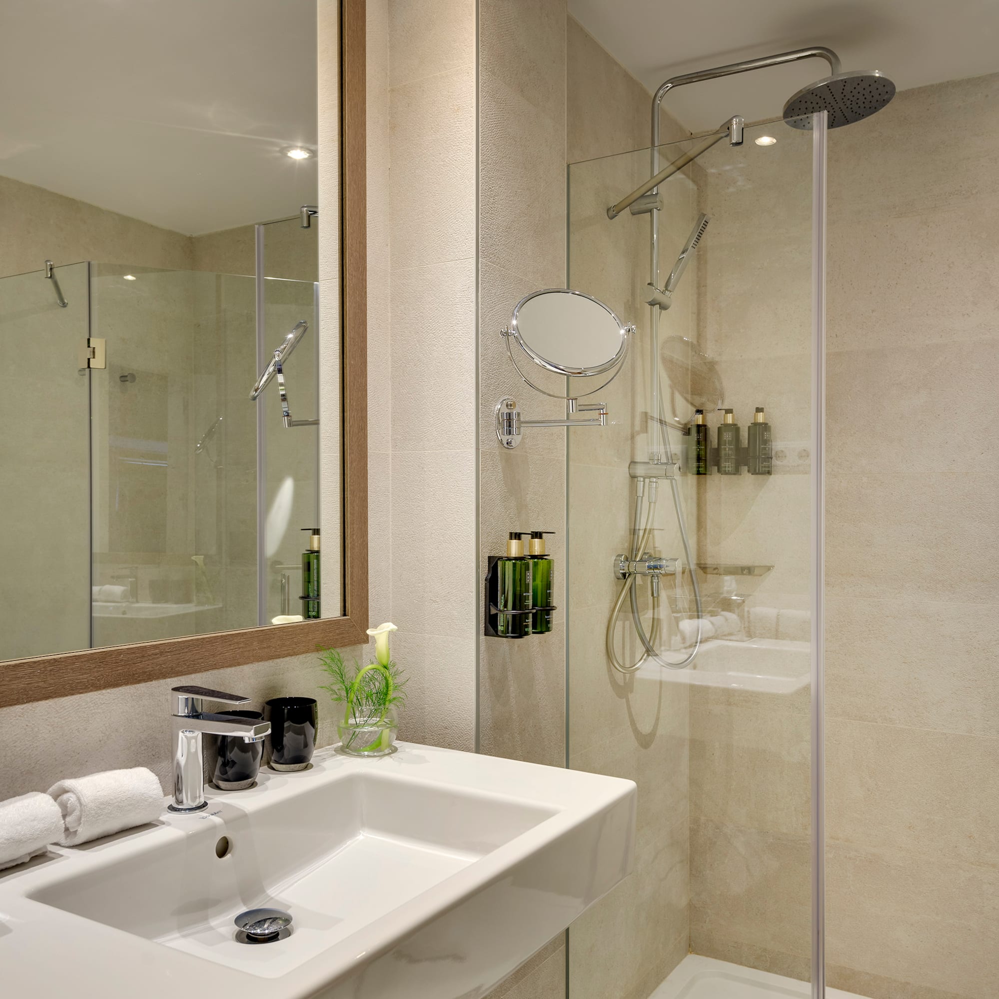 a bathroom with a shower and sink