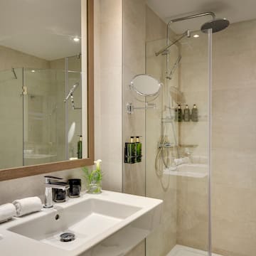 a bathroom with a shower and sink