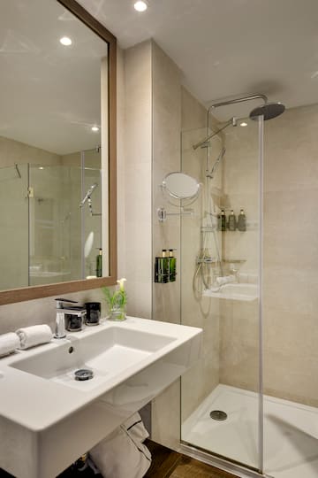 a bathroom with a shower and sink