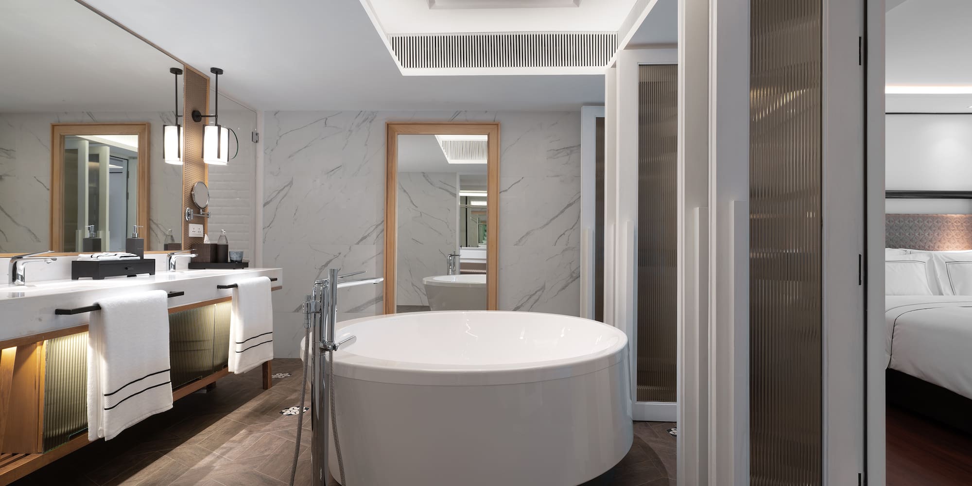 a bathroom with a large tub and sink