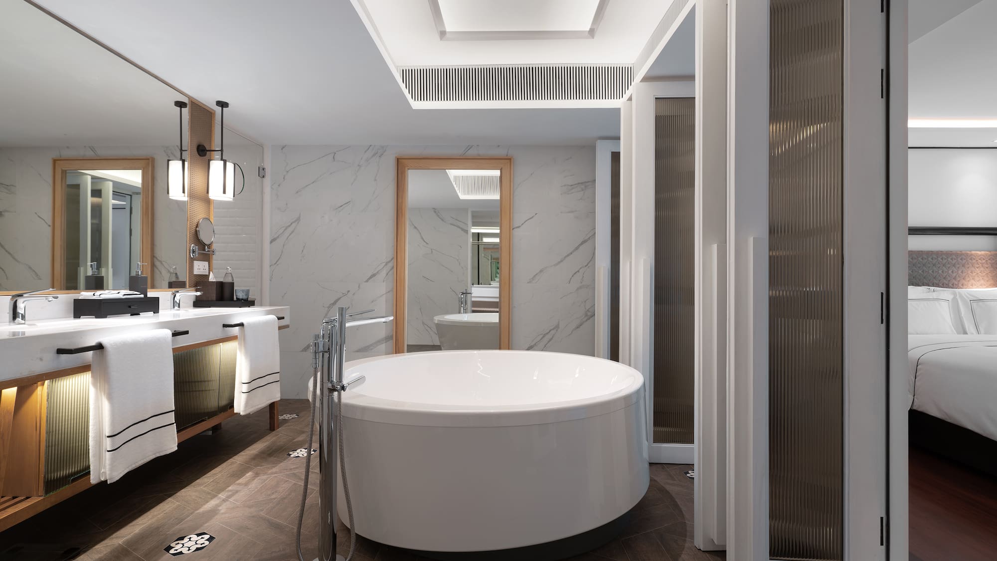 a bathroom with a large tub and sink