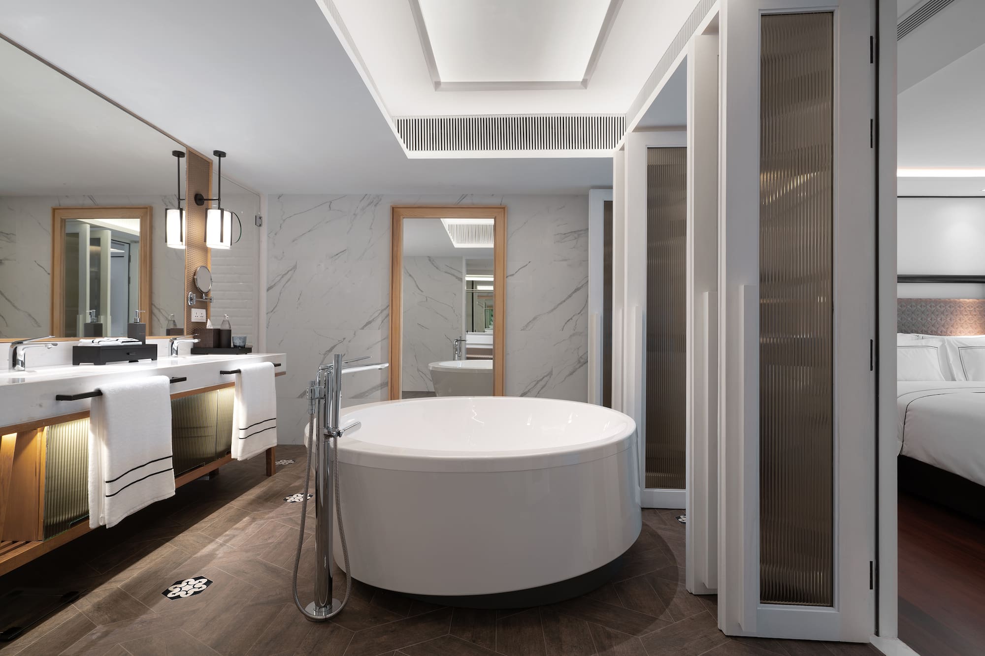 a bathroom with a large tub and sink