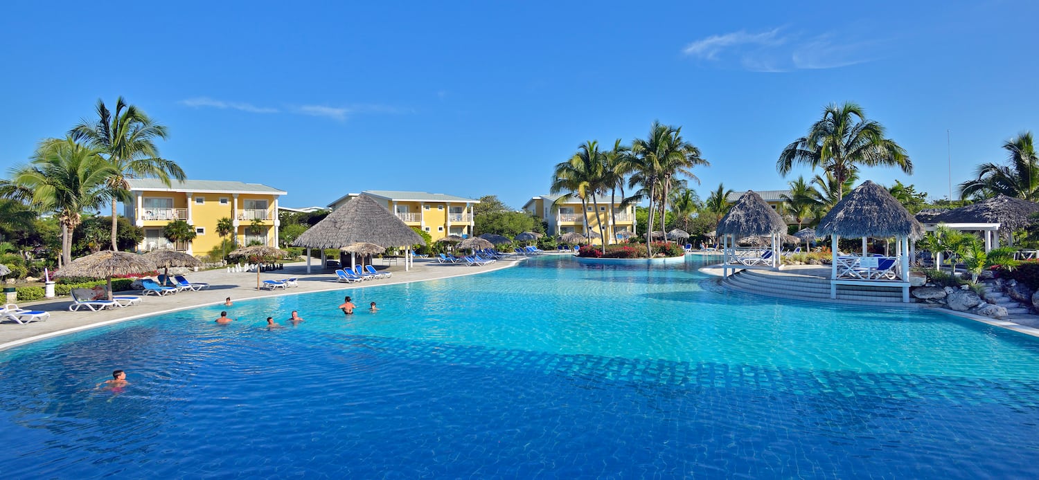 a pool with people swimming in it