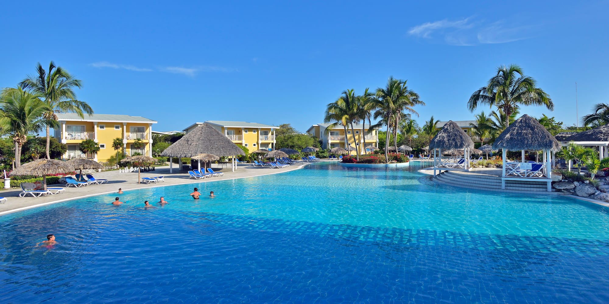 a pool with people swimming in it