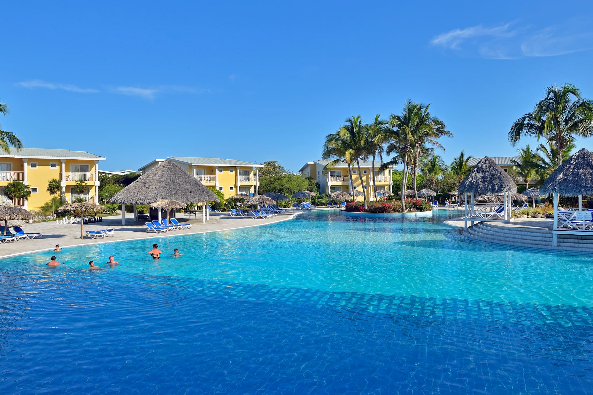 a pool with people swimming in it