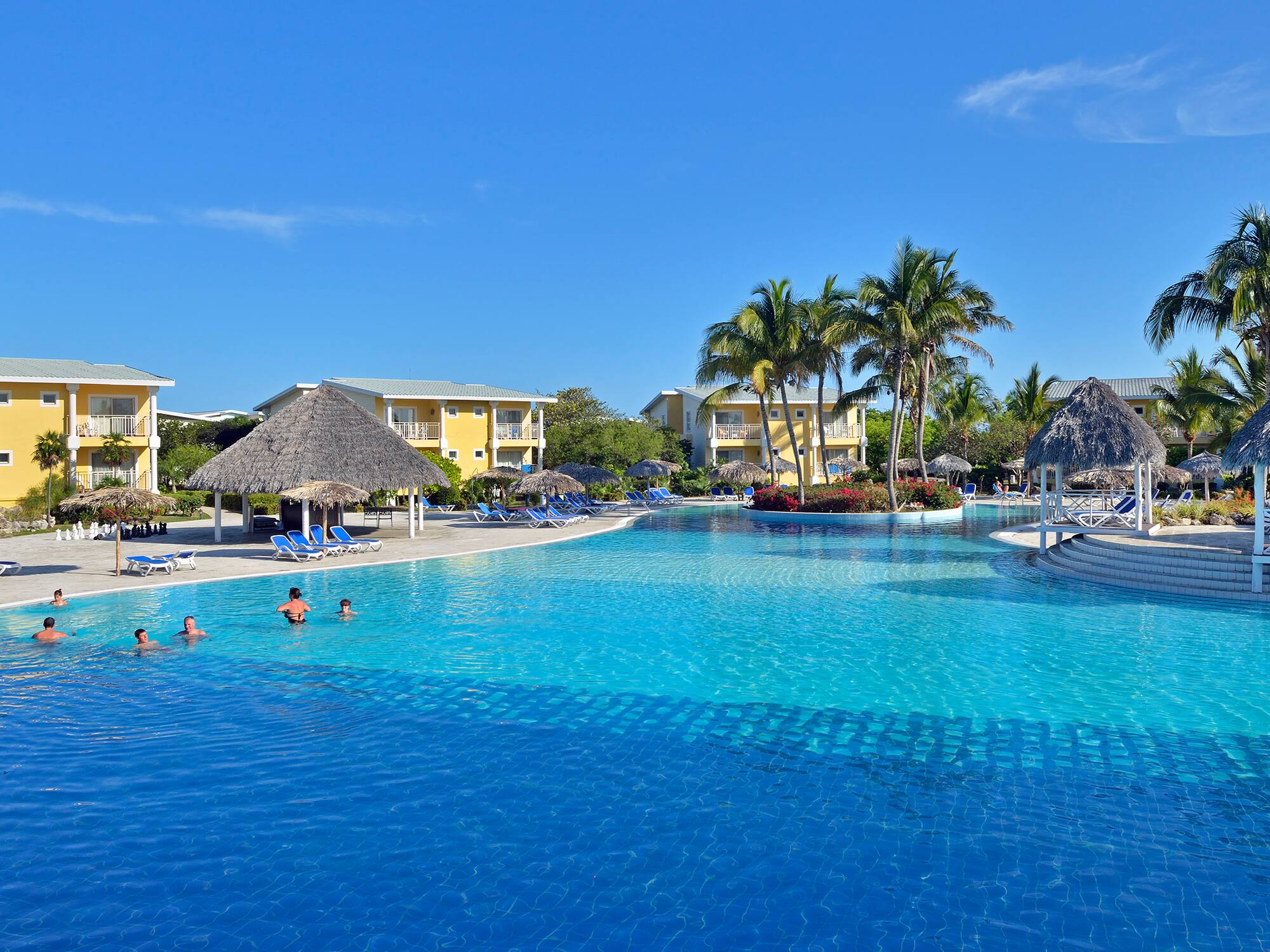 a pool with people swimming in it