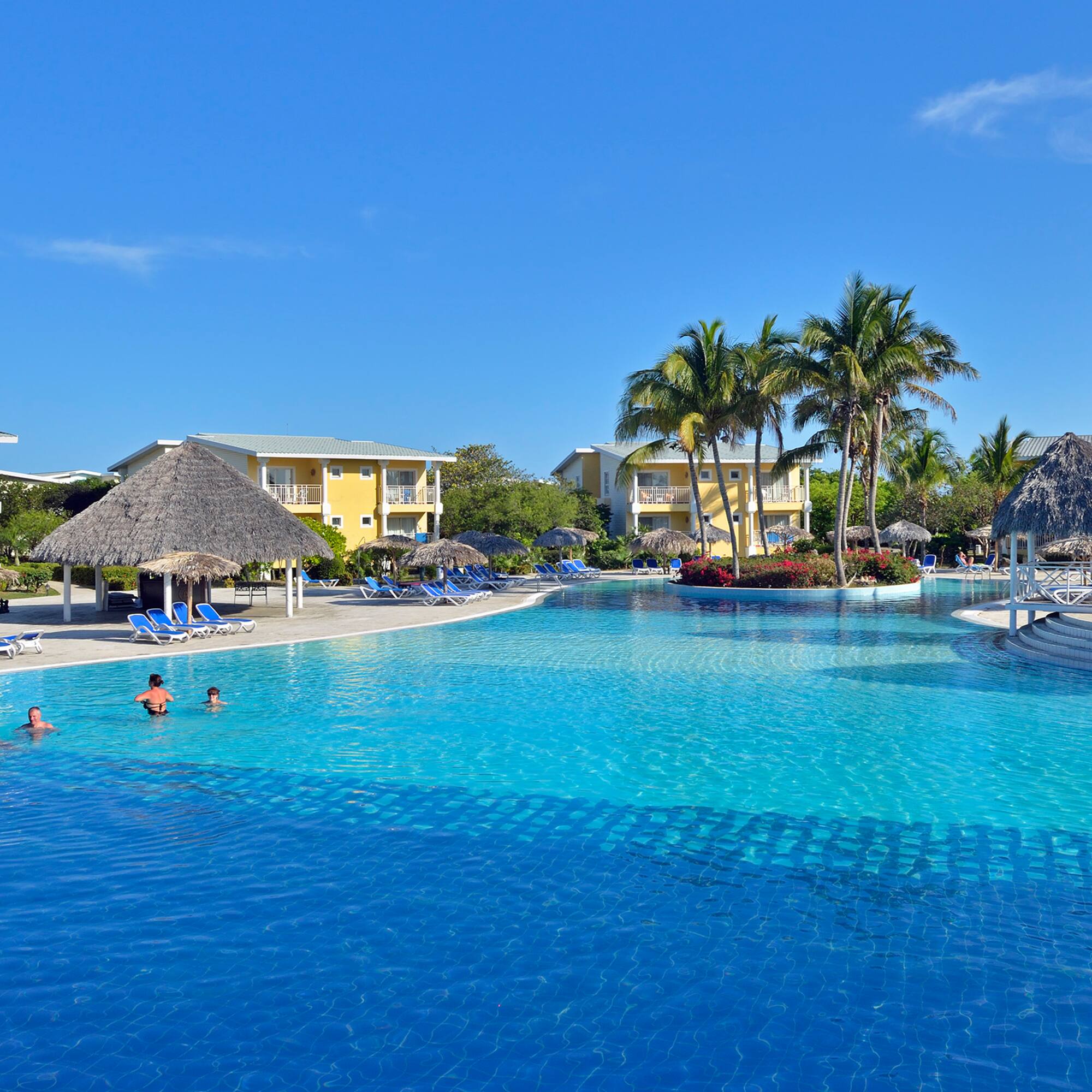 a pool with people swimming in it