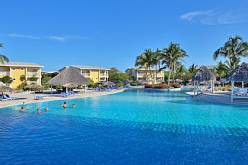 a pool with people swimming in it