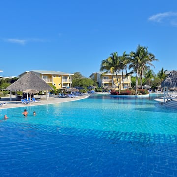 a pool with people swimming in it