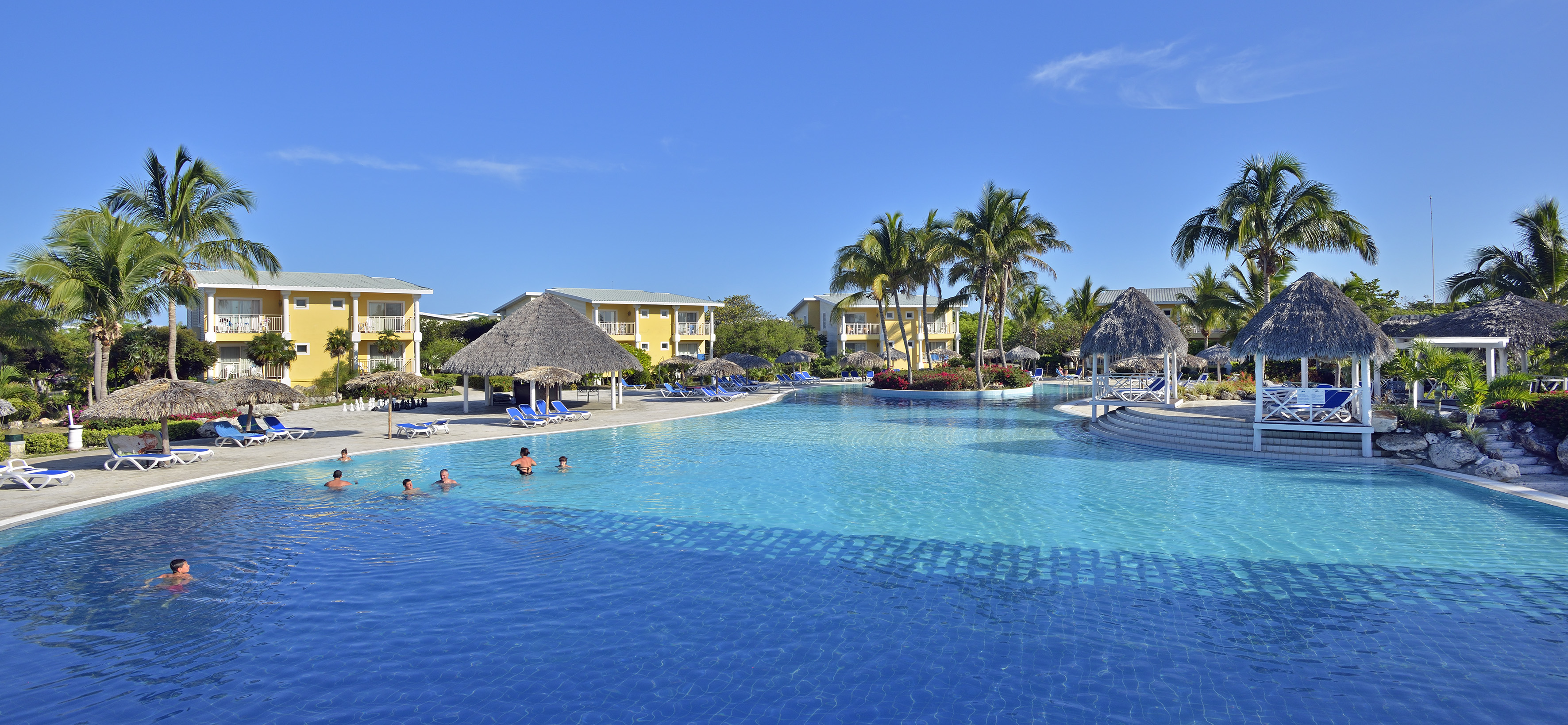 a pool with people swimming in it