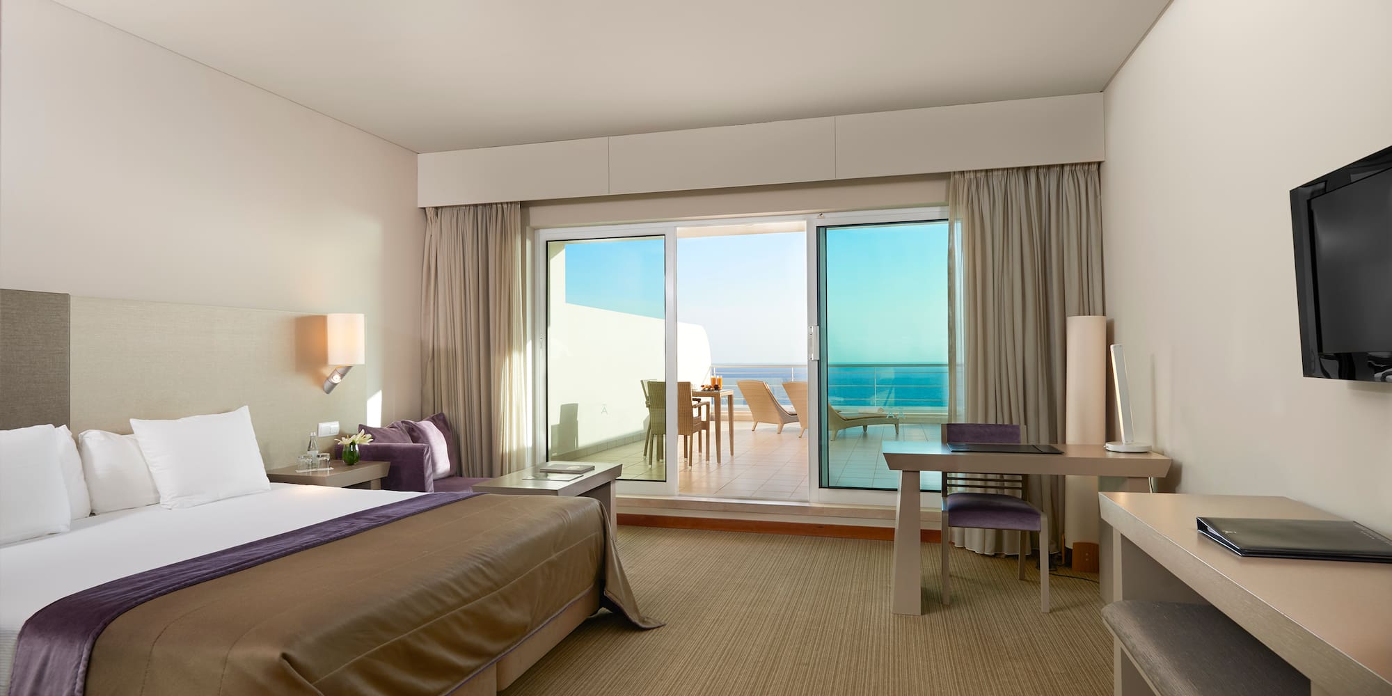 a bedroom with a bed and a desk