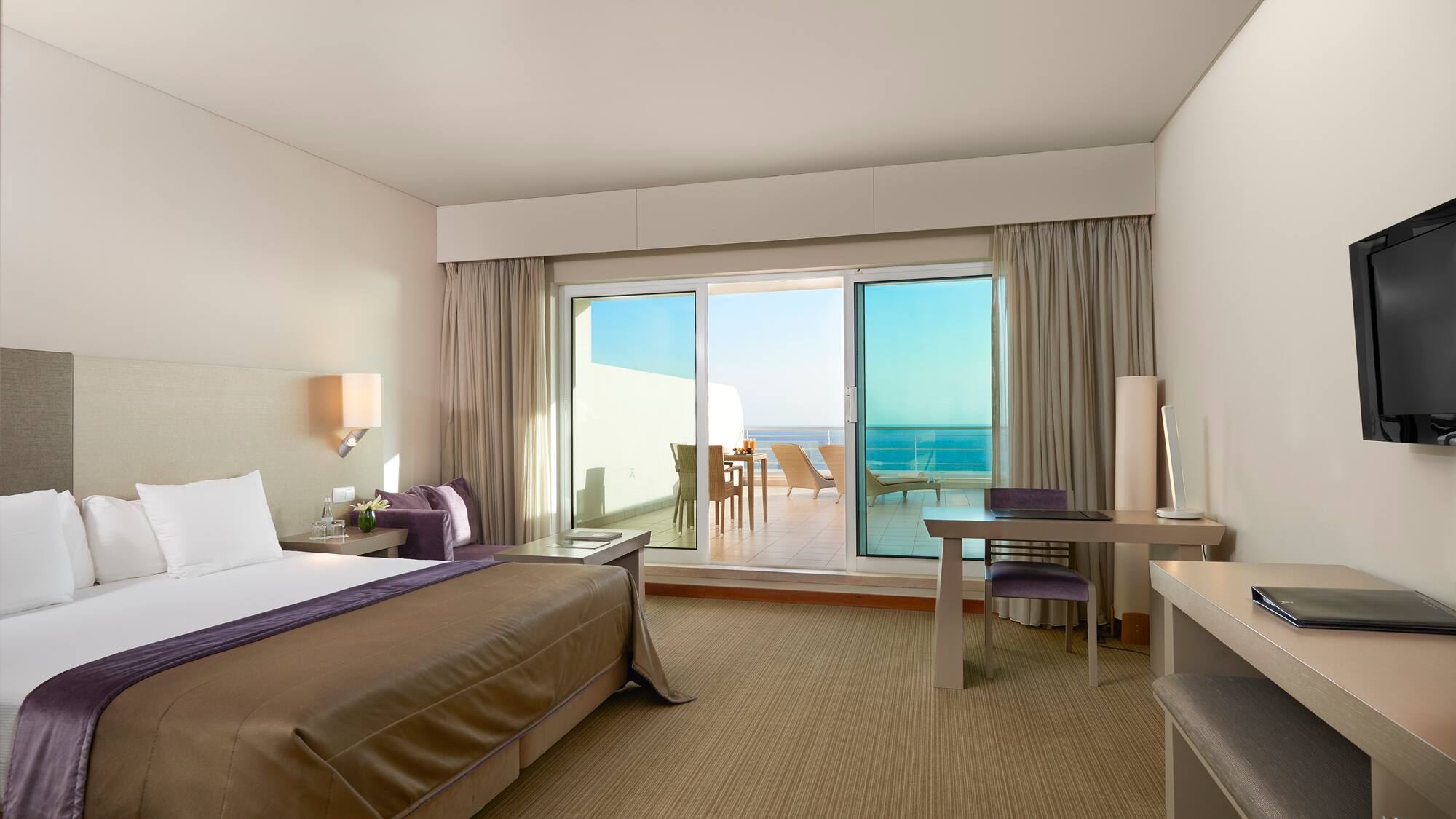 a bedroom with a bed and a desk