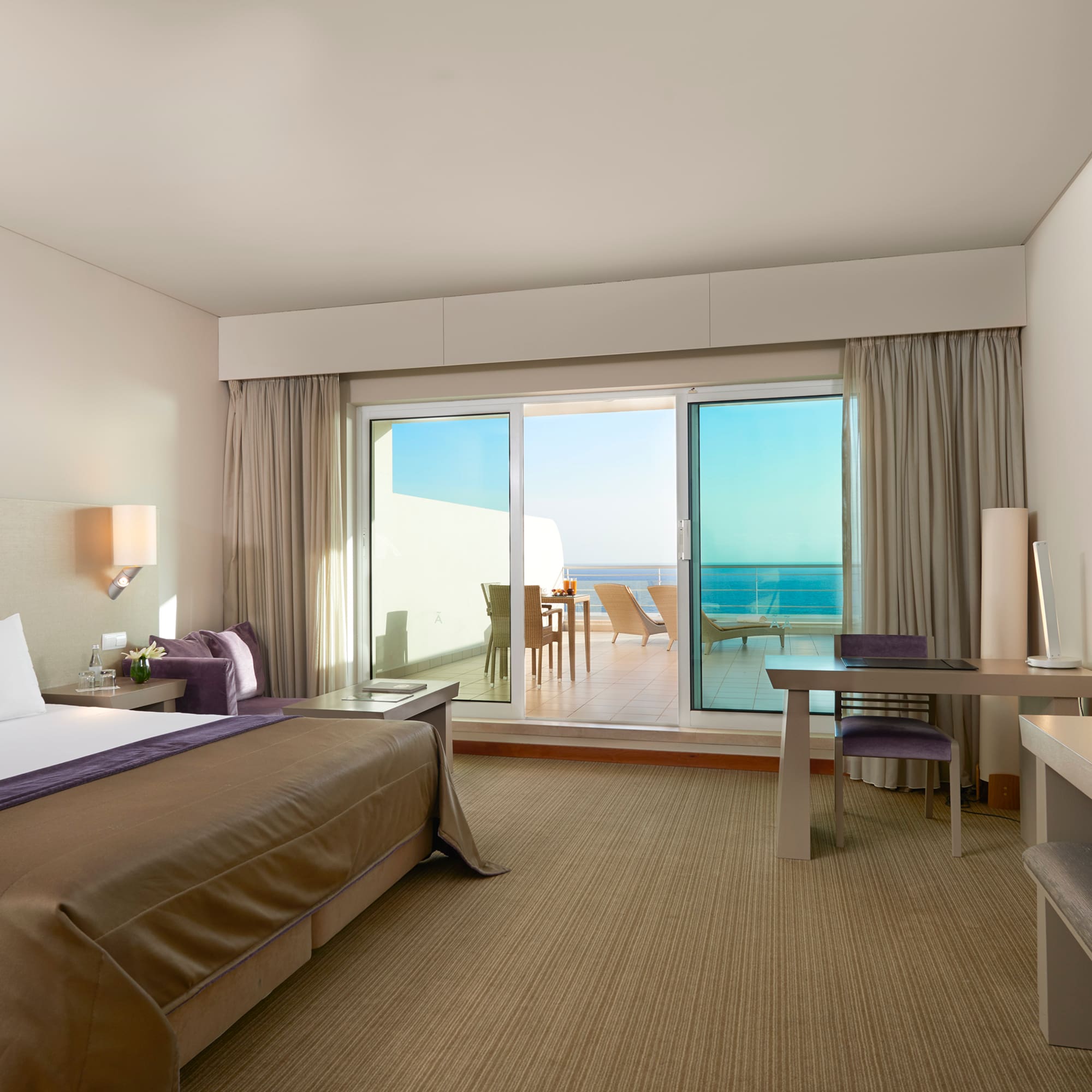 a bedroom with a bed and a desk