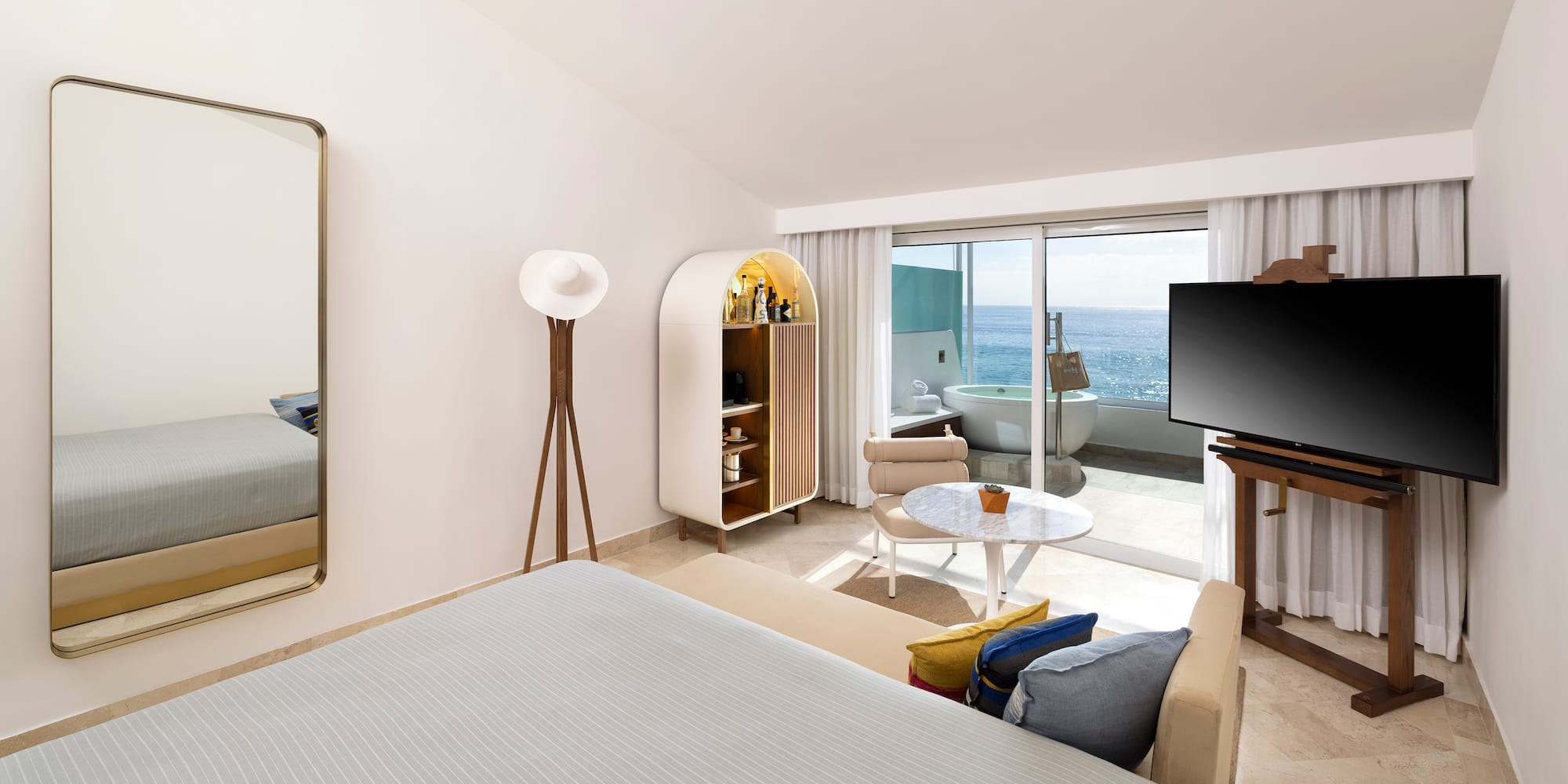 a room with a bed and a television