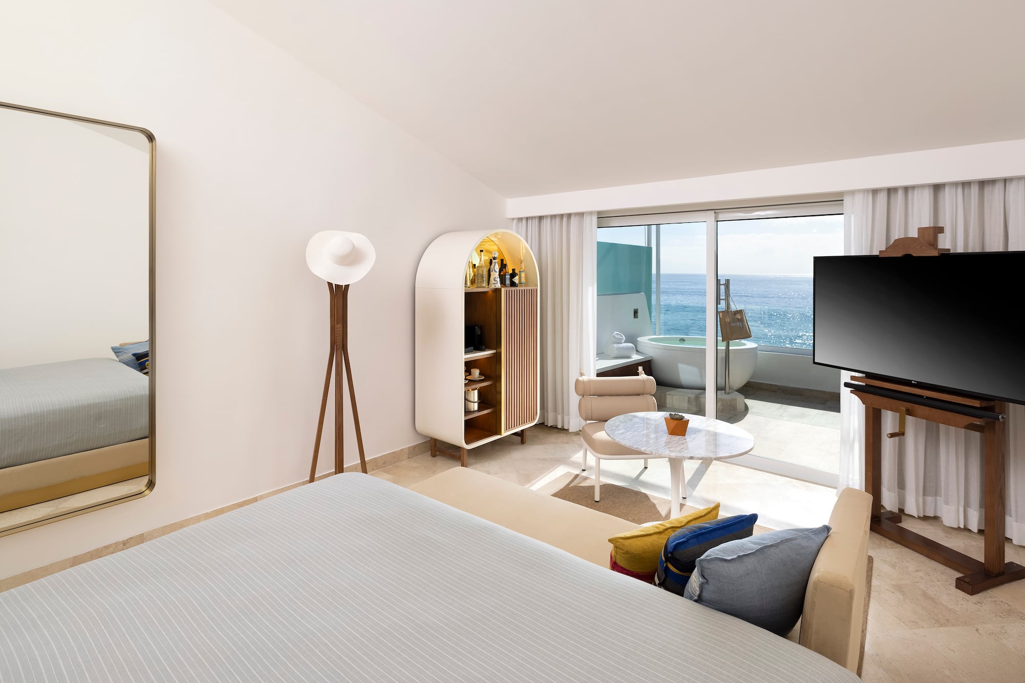 a room with a bed and a television