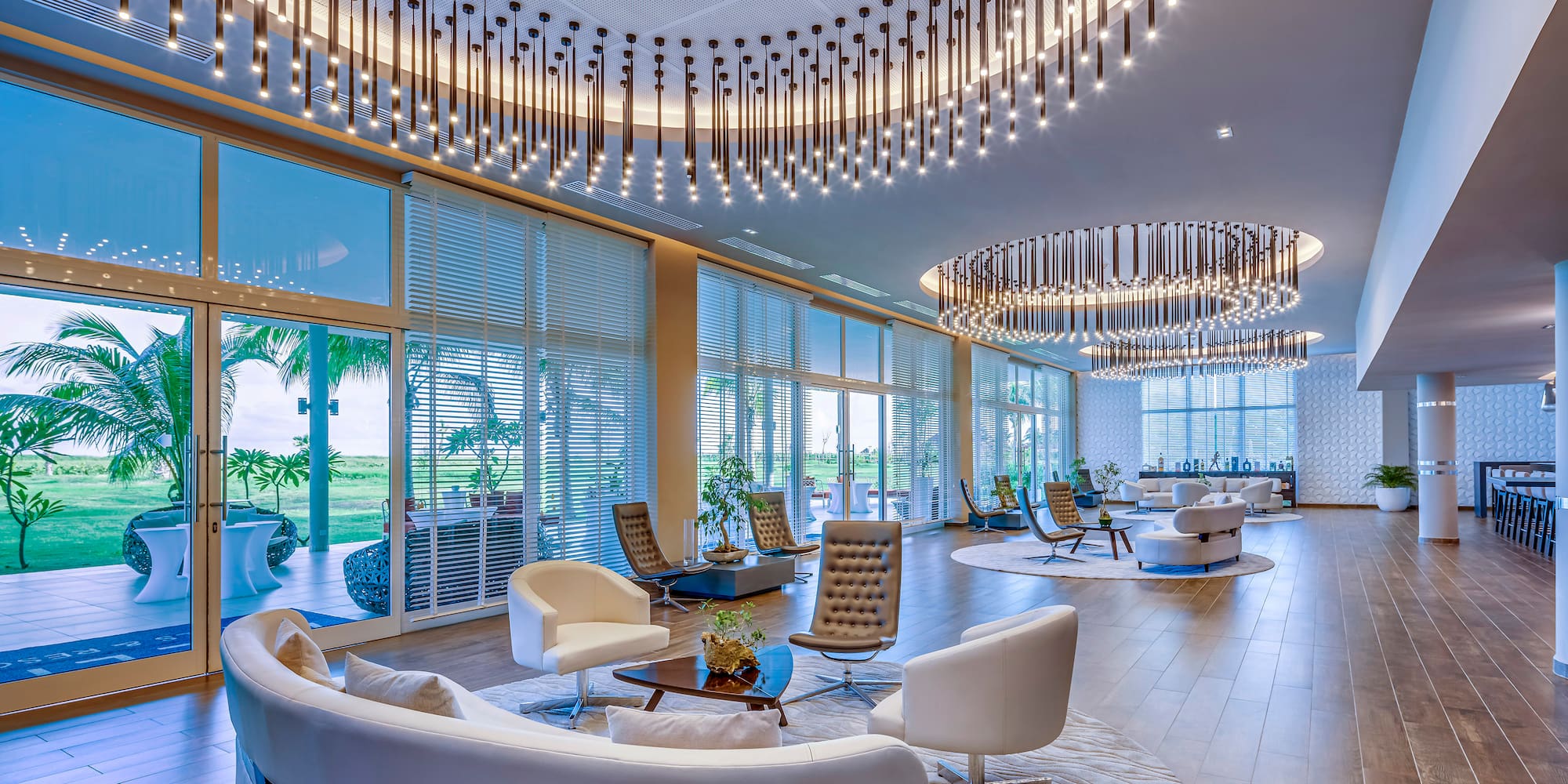 a large room with a large chandelier and chairs