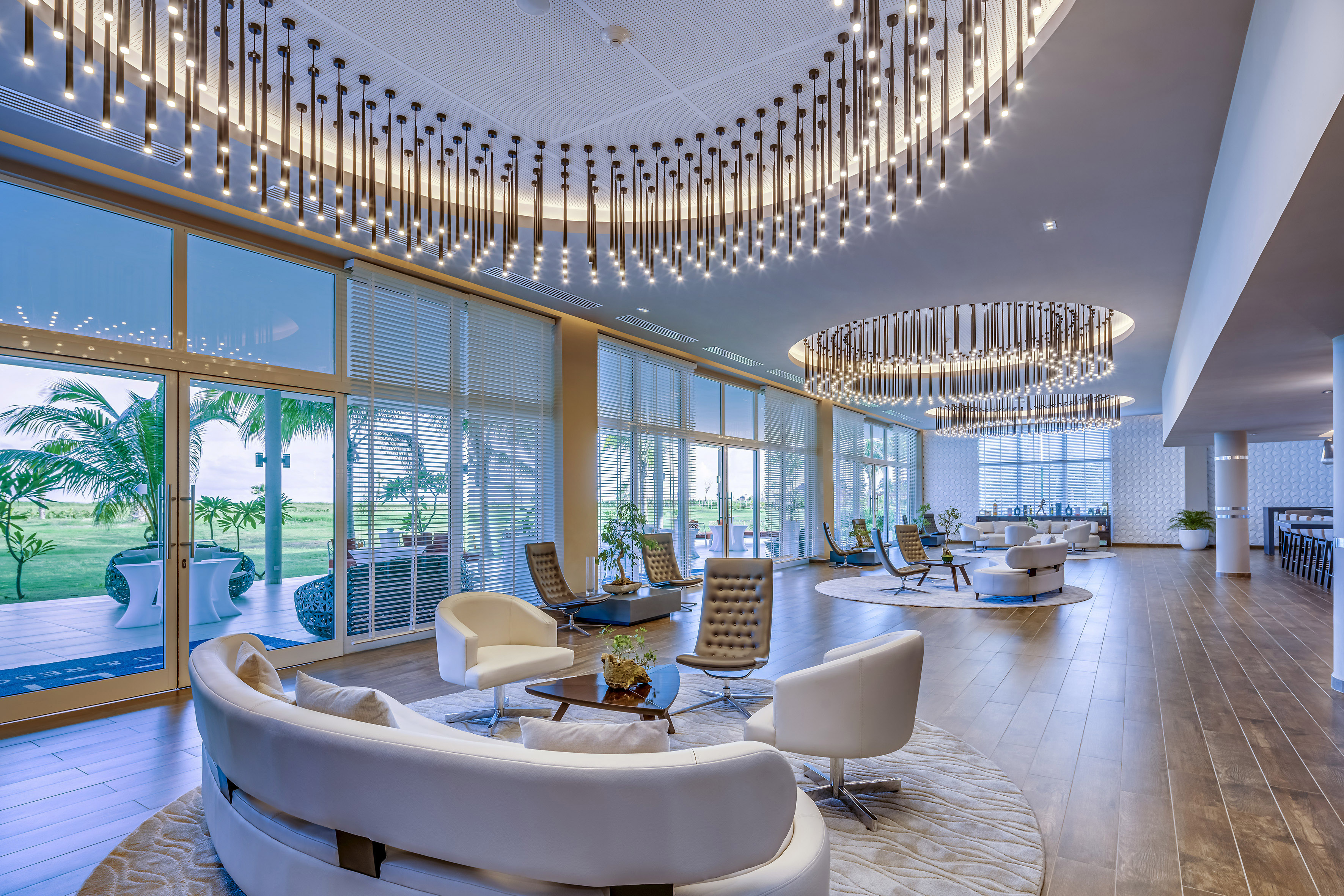a large room with a large chandelier and chairs