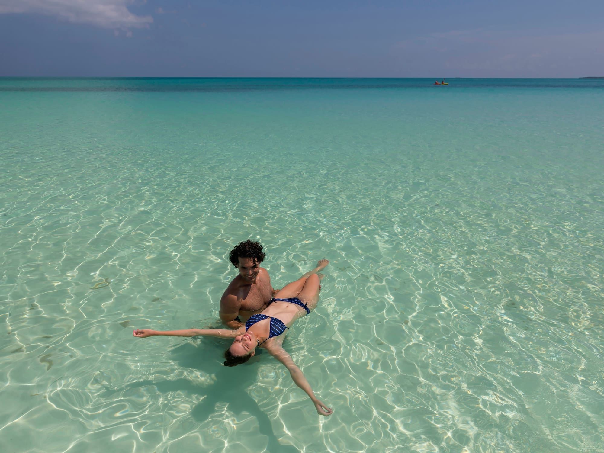 a man and woman in a garment in the water