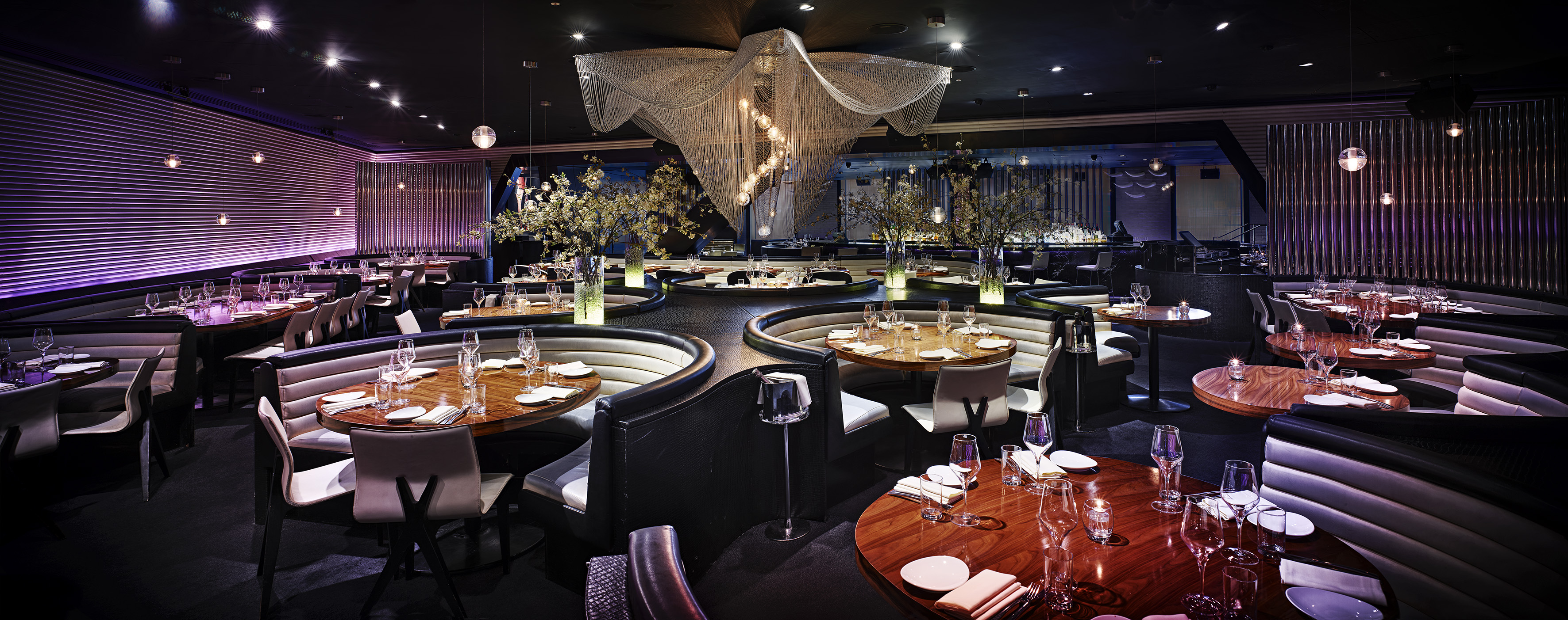 a restaurant with tables and chairs