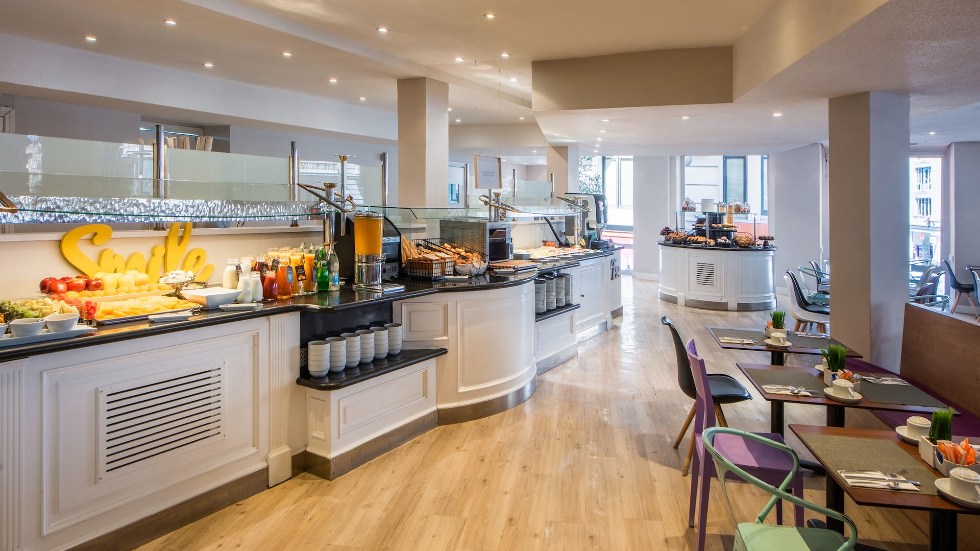 a restaurant with a buffet and tables