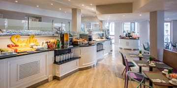 a restaurant with a buffet and tables