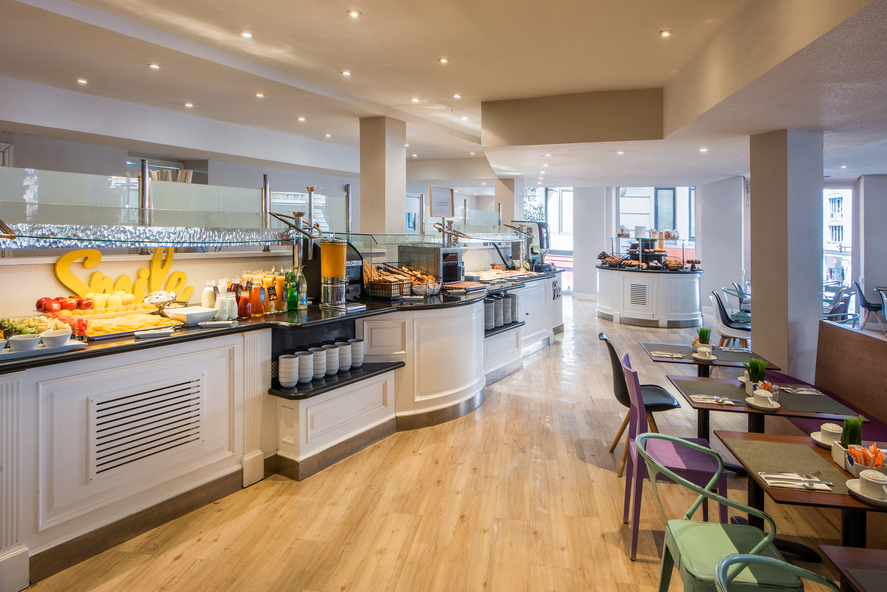 a restaurant with a buffet and tables