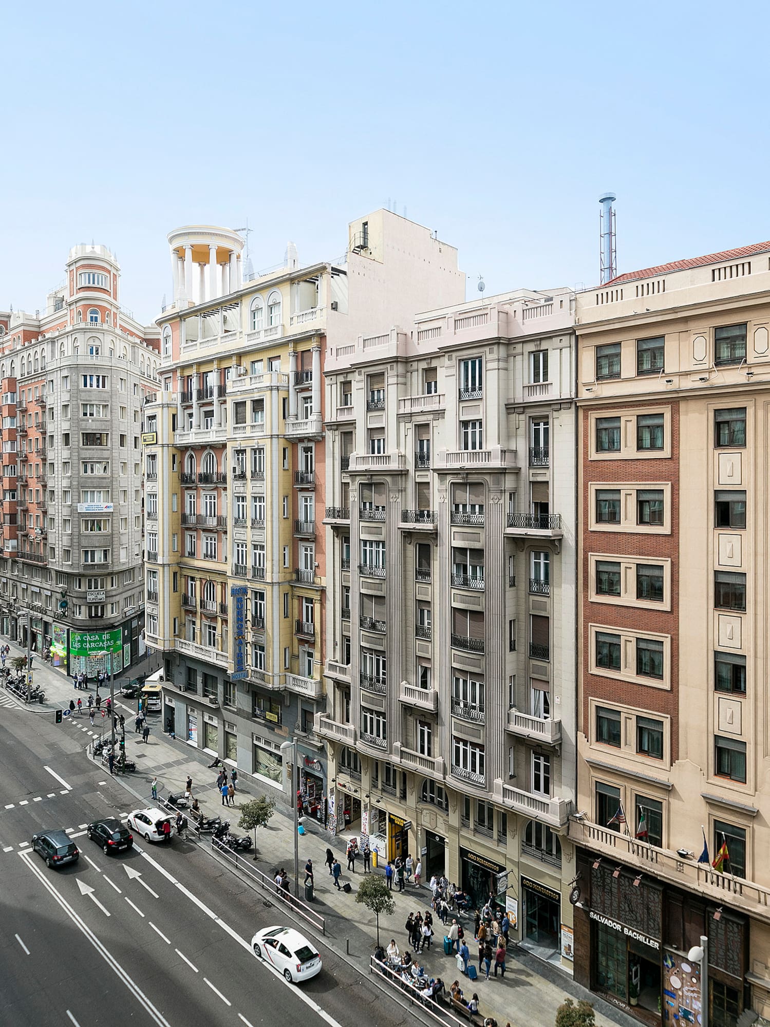 a street with cars and buildings